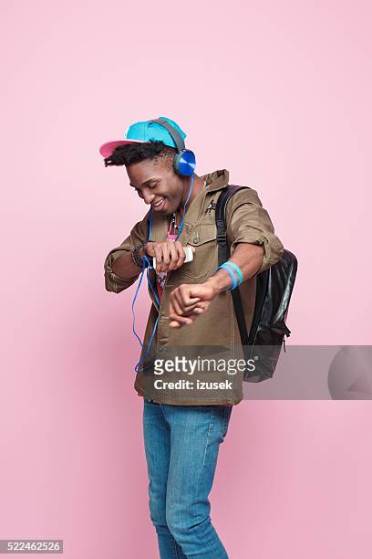 studio portrait of funky, excited afro american young man - cool attitude stock pictures, royalty-free photos & images