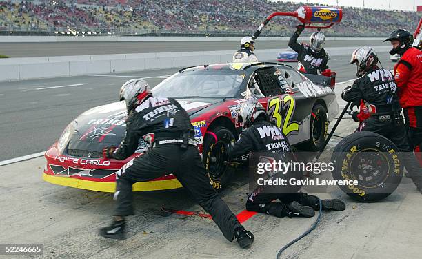 Shane Hmiel, driver of the Win Fuel Chevrolet, makes a fuel and tire stop during the NASCAR Busch Series Stater Bros. 300 on February 26, 2005 at the...