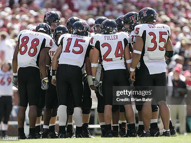 The Texas Tech Red Raiders offensive team huddles while facing the Oklahoma Sooners on October 2, 2004 at Memorial Stadium in Norman, Oklahoma. The...