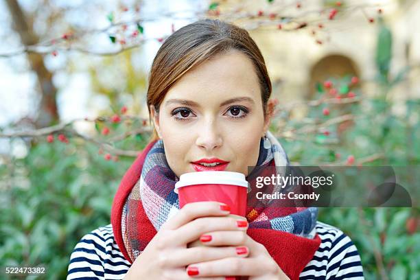 young woman drinking coffee - take away coffee cup stock pictures, royalty-free photos & images