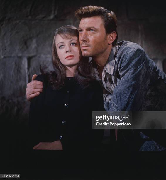 English actress Sarah Miles pictured with British actor Laurence Harvey in a scene from the film 'The Ceremony' in 1963.
