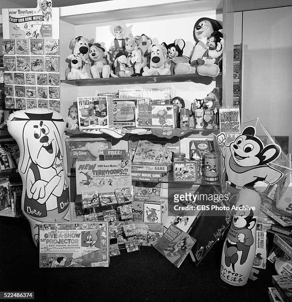 Photographs of a display of CBS Enterprises consumer products. Items include: "Mighty Mouse" games and memorabilia. New York, NY. Image dated...