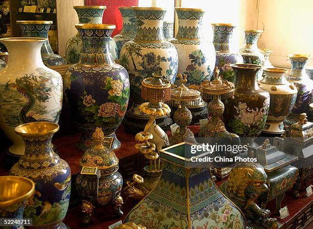 Delicate cloisonne products are displayed at Beijing Enamel Factory on February 24, 2005 in Beijing, China. Cloisonne enamel was probably introduced...