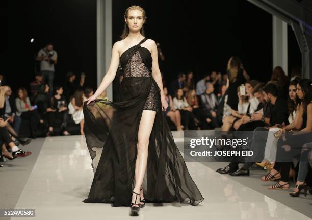 Model displays a creation by Lebanese designer Abed Mahfouz haute couture collection during 'La Mode a Beyrouth' fashion week in Beirut on April 19,...