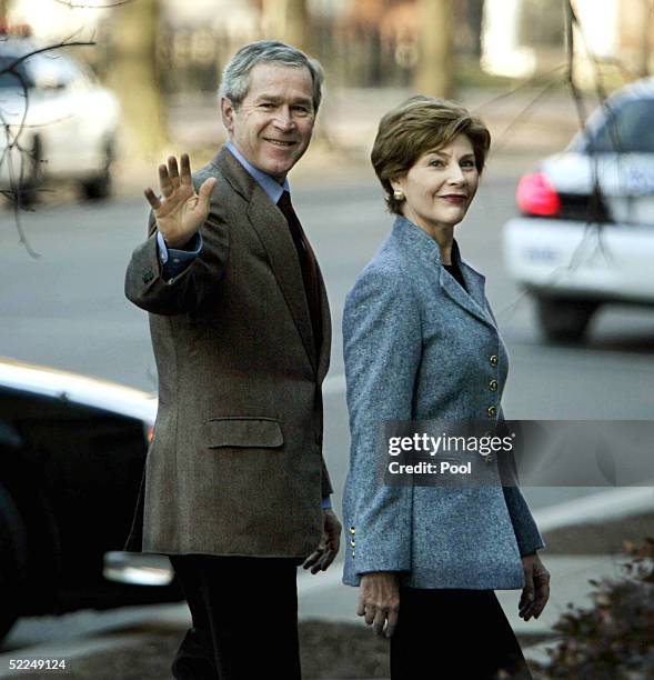 President George W. Bush gestures as he and his wife, first lady Laura Bush, attend St. John's church February 27, 2005 in Washington, DC.