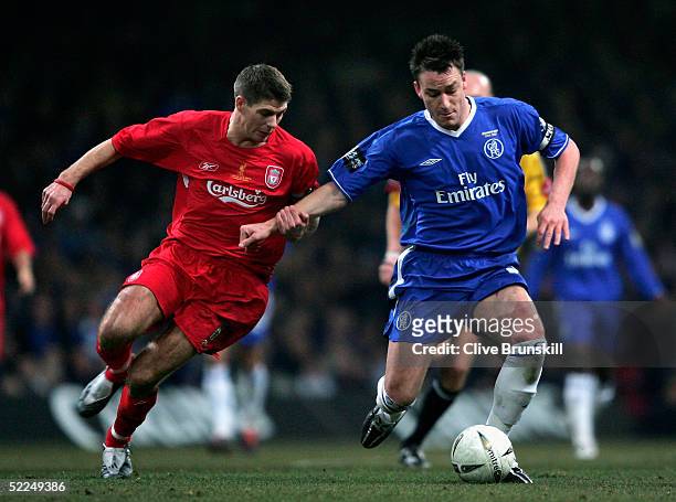 Steven Gerrard of Liverpool battles with John Terry of Chelsea during the Carling Cup Final match between Chelsea and Liverpool at the Millennium...