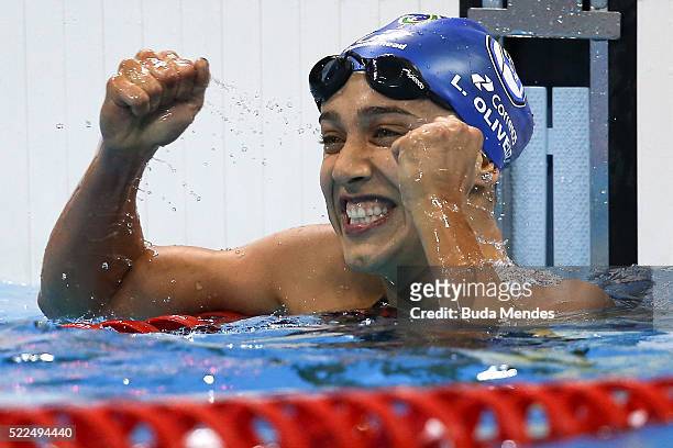 Larissa Martins Oliveira of Brazil reacts after swimming the Women's 100m Freestyle final during the Maria Lenk Trophy competition at the Aquece Rio...