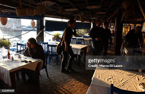Lebanese have lunch at the exclusive marina of Byblos on February 26 50 Km north of Beirut, Lebanon.Tens of thousands of Lebanese protesters have...