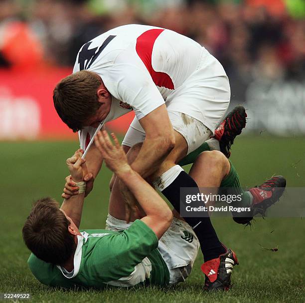 Mark Cueto of England fights with Ronan O'Gara of Ireland during the RBS Six Nations Championship match between Ireland and England at Lansdowne Road...