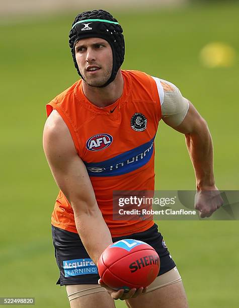 Marc Murphy of the Blues handballs during a Carlton Blues AFL training session at Ikon Park on April 20, 2016 in Melbourne, Australia.