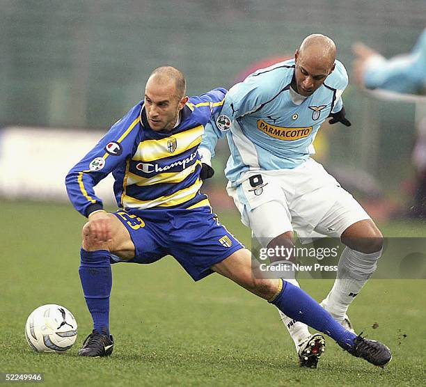 Marco Bresciano of Parma is tackled by Ousmane Dabo of Lazio during the match between Lazia and Parma at the Olympico Stadium on February 27, 2005 in...