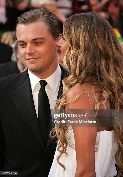 Actor Leonardo DiCaprio, nominated for Best Actor for his role in "The Aviator," arrives with girlfriend Brazilian model Gisele Bundchen at the 77th...