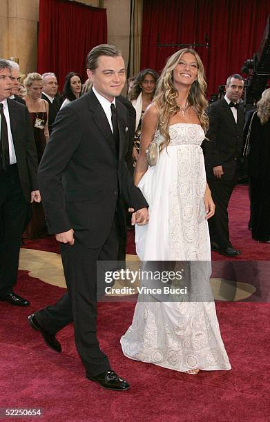 Actor Leonardo DiCaprio, nominated for Best Actor for his role in "The Aviator," arrives with girlfriend Brazilian model Gisele Bundchen at the 77th...