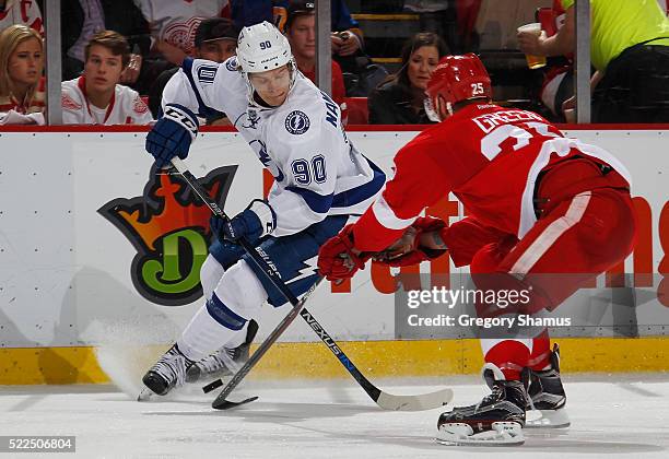 Vladislav Namestnikov of the Tampa Bay Lightning battles for the puck with Mike Green of the Detroit Red Wings during the third period of Game Four...