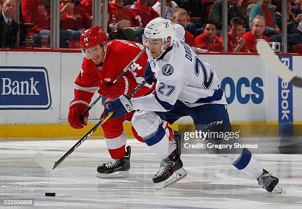 Jonathan Drouin of the Tampa Bay Lightning tries to out skate Gustav Nyquist of the Detroit Red Wings during the third period of Game Four of the...