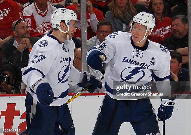 Ondrej Palat of the Tampa Bay Lightning celebrates his third period goal with Jonathan Drouin when playing the Detroit Red Wings in Game Four of the...