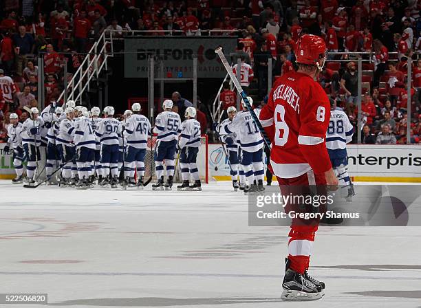 Justin Abdelkader of the Detroit Red Wings looks on as the Tampa Bay Lightning celebrate a 3-2 win of Game Four of the Eastern Conference First Round...
