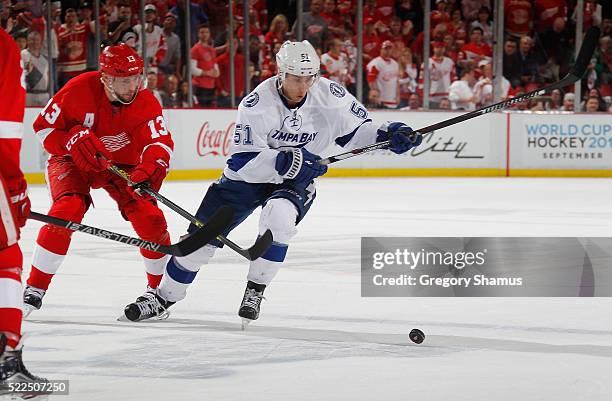 Valtteri Filppula of the Tampa Bay Lightning tries to get around Pavel Datsyuk of the Detroit Red Wings during the third period of Game Four of the...