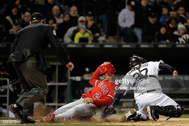 Andrelton Simmons of the Los Angeles Angels of Anaheim is tagged out by Dioner Navarro of the Chicago White Sox at home plate during the seventh...