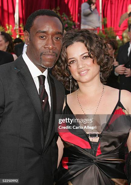 Actors Don Cheadle and Bridgid Coulter arrive at the 77th Annual Academy Awards at the Kodak Theater on February 27, 2005 in Hollywood, California.