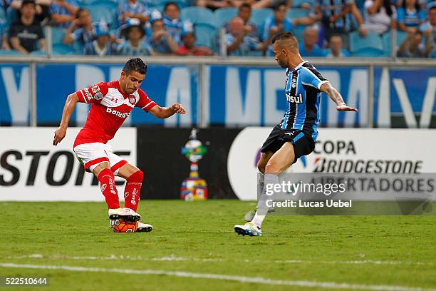 Luan of Gremio battles for the ball against Francisco Gamboa of Toluca during the match Gremio v Toluca as part of Copa Bridgestone Libertadores...