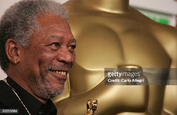 Actor Morgan Freeman poses backstage with his Oscar for Best Actor in a Supporting Role in "Million Dollar Baby" during the 77th Annual Academy...