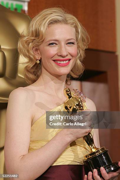 Actress Cate Blanchett poses with her "Best Performance by a Supporting Actress" award for "The Aviator" backstage during the 77th Annual Academy...