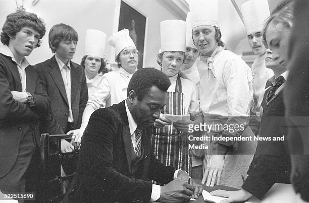 Pele signing autographs in Royal Hibernian hotel, Dublin. Circa May 1979. .