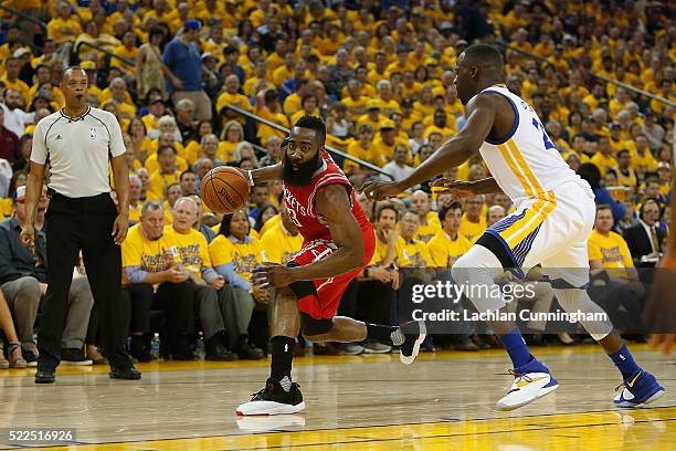 James Harden of the Houston Rockets is guarded by Draymond Green of the Golden State Warriors in the first quarter in Game Two of the Western...