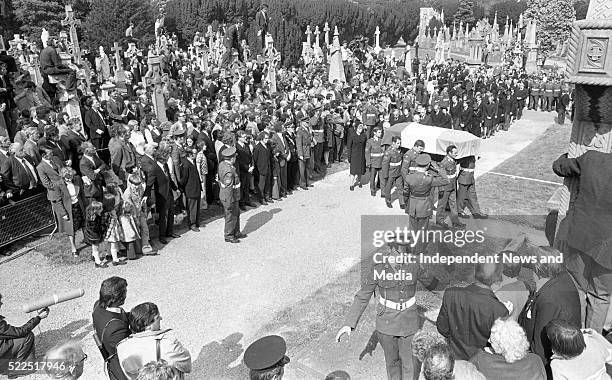 The remains of the President Eamonn de Valera being brought for burial at Glasnevin Cemetery. . .