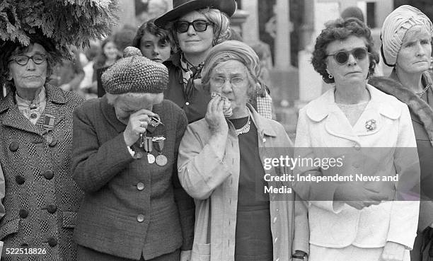 Two members of Cumann na mBan at the burial of the late President Eamonn de Valera in Glasnevin cemetery. . .