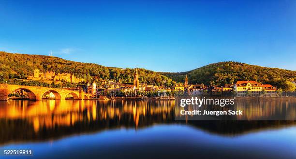 blick auf heidelberg bei sonnenuntergang - heidelberg germany stock-fotos und bilder