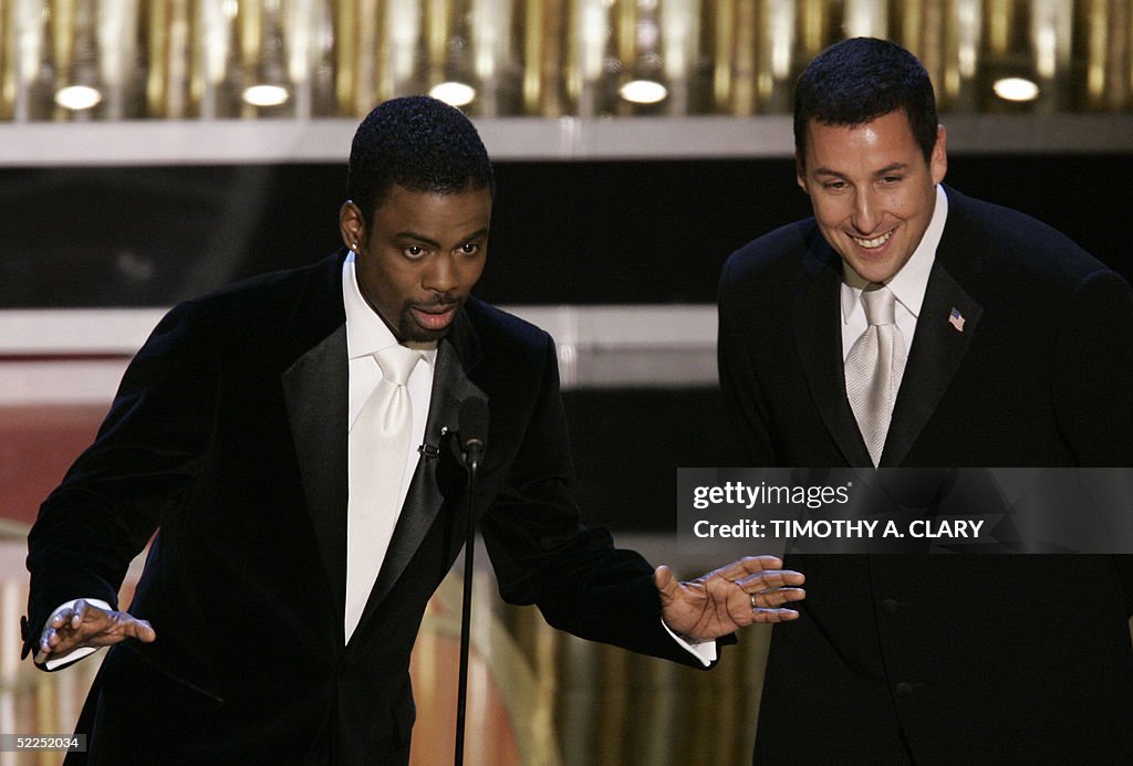 Oscar host Chris Rock (L) and actor Adam
