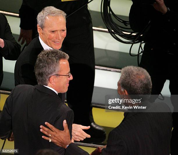 Actor/director Clint Eastwood, Tom Rosenberg and Morgan Freeman win the award for Best Picture for "Million Dollar Baby" onstage during the 77th...