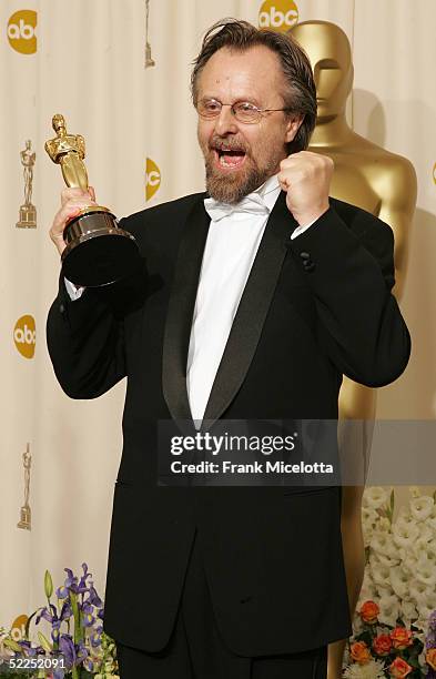 Composer Jan A.P. Kaczmarek pose with his "Achievement In Music " award for "Finding Neverland" backstage during the 77th Annual Academy Awards on...