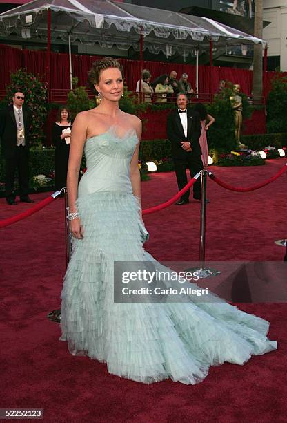 Charlize Theron arrives at the 77th Annual Academy Awards at the Kodak Theater on February 27, 2005 in Hollywood, California.