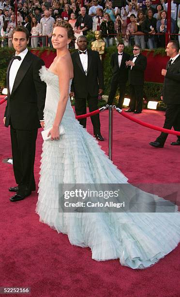 Actress Charlize Theron arrives with her husband Stuart Townsend arrive at the 77th Annual Academy Awards at the Kodak Theater on February 27, 2005...