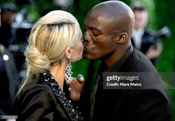 Model Heidi Klum kisses fiance, musician Seal, as they arrive at the Vanity Fair Oscar Party at Mortons on February 27, 2005 in West Hollywood,...