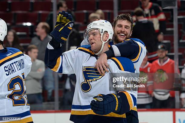 Paul Stastny and Alex Pietrangelo of the St. Louis Blues celebrate after defeating the Chicago Blackhawks 4 to 3 in Game Four of the Western...