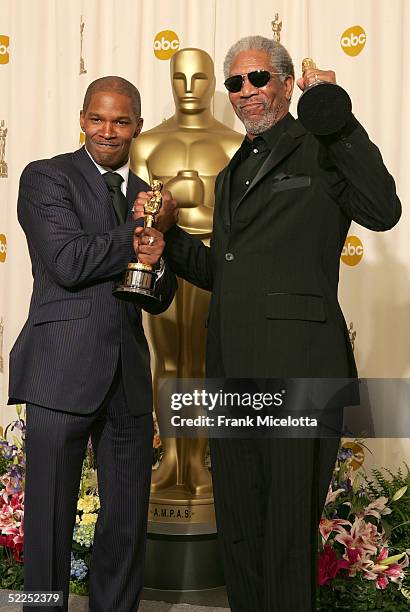 Winners of Best Supporting Actor Morgan Freeman and Best Actor Jamie Foxx pose backstage with their Oscar awards during the 77th Annual Academy...