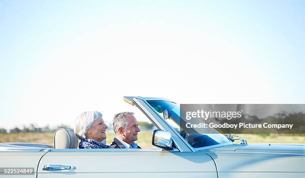 settling in on the long road - older couple driving car stock pictures, royalty-free photos & images