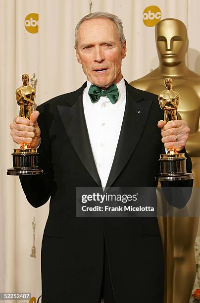 Director Clint Eastwood poses with his Oscar award for Best Director in "Million Dollar Baby" backstage during the 77th Annual Academy Awards on...