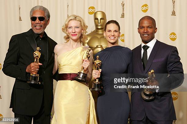 Best supporting actor Morgan Freeman, best supporting actress Cate Blanchett, best actress Hilary Swank and best actor Jamie Foxx pose backstage with...