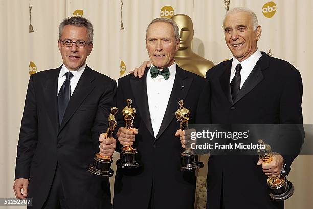 Producers Tom Rosenberg, Clint Eastwood and Albert S. Ruddy pose with the award for Best Movie for "Million Dollar Baby" backstage during the 77th...