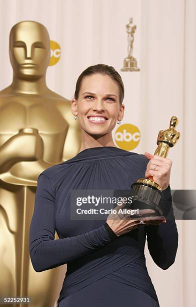 Actress Hilary Swank poses with her award for Best Actress for "Million Dollar Baby" backstage during the 77th Annual Academy Awards on February 27,...