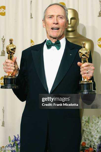 Producer Clint Eastwood poses with his awards for Best Motion Picture and Best Director for "Million Dollar Baby" backstage during the 77th Annual...