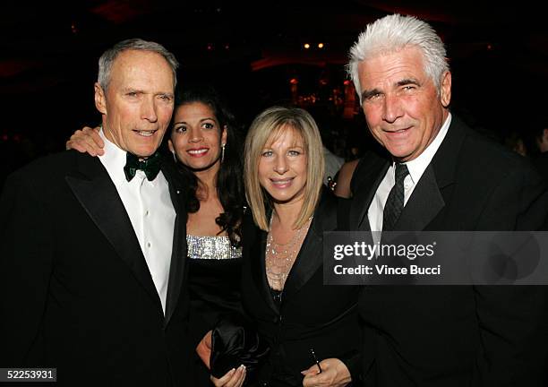 Director Clint Eastwood, Dina Ruiz Eastwood, Barbra Streisand and James Brolin attend the Governors Ball after the 77th Annual Academy Awards at the...