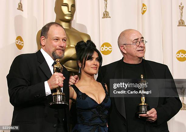 Composers Michael Silvers and Randy Thom pose with their "Achievement In Sound Editing" award for "The Incredibles" with presenter Salma Hayek...