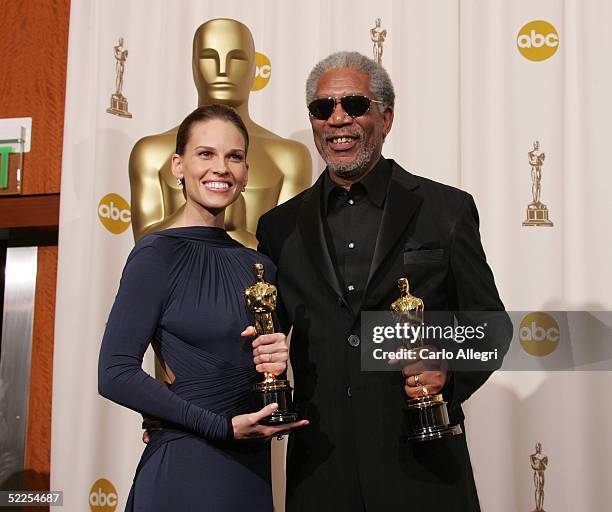 Actors Hilary Swank and Morgan Freeman pose for a photo backstage during the 77th Annual Academy Awards on February 27, 2005 at the Kodak Theater in...