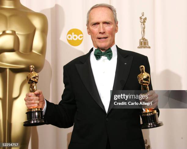 Director Clint Eastwood poses with his Oscar award for Best Director in "Million Dollar Baby" backstage during the 77th Annual Academy Awards on...